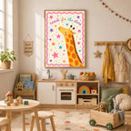 A framed giraffe reach for the stars print hangs on a light-colored wall above a wooden play kitchen and toy shelf in a child's room.