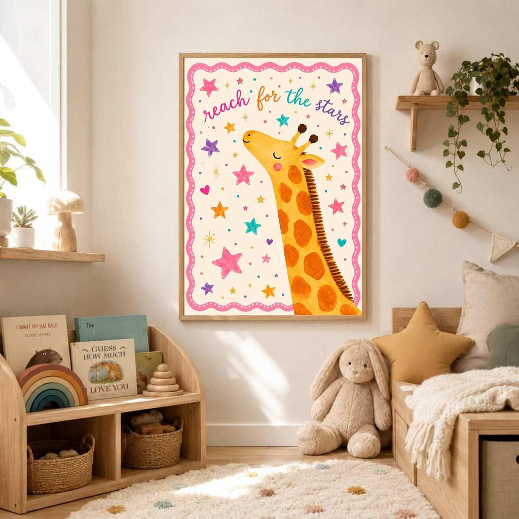 A framed children's poster featuring an illustrated giraffe and the text reach for the stars hangs on a white wall above a wooden toy shelf filled with books and baskets.