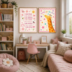 A framed print of a giraffe with reach for the stars text hangs on a pink wall above a low white cabinet, alongside a bed with a pink spread, stuffed animals, and decorative cushions.