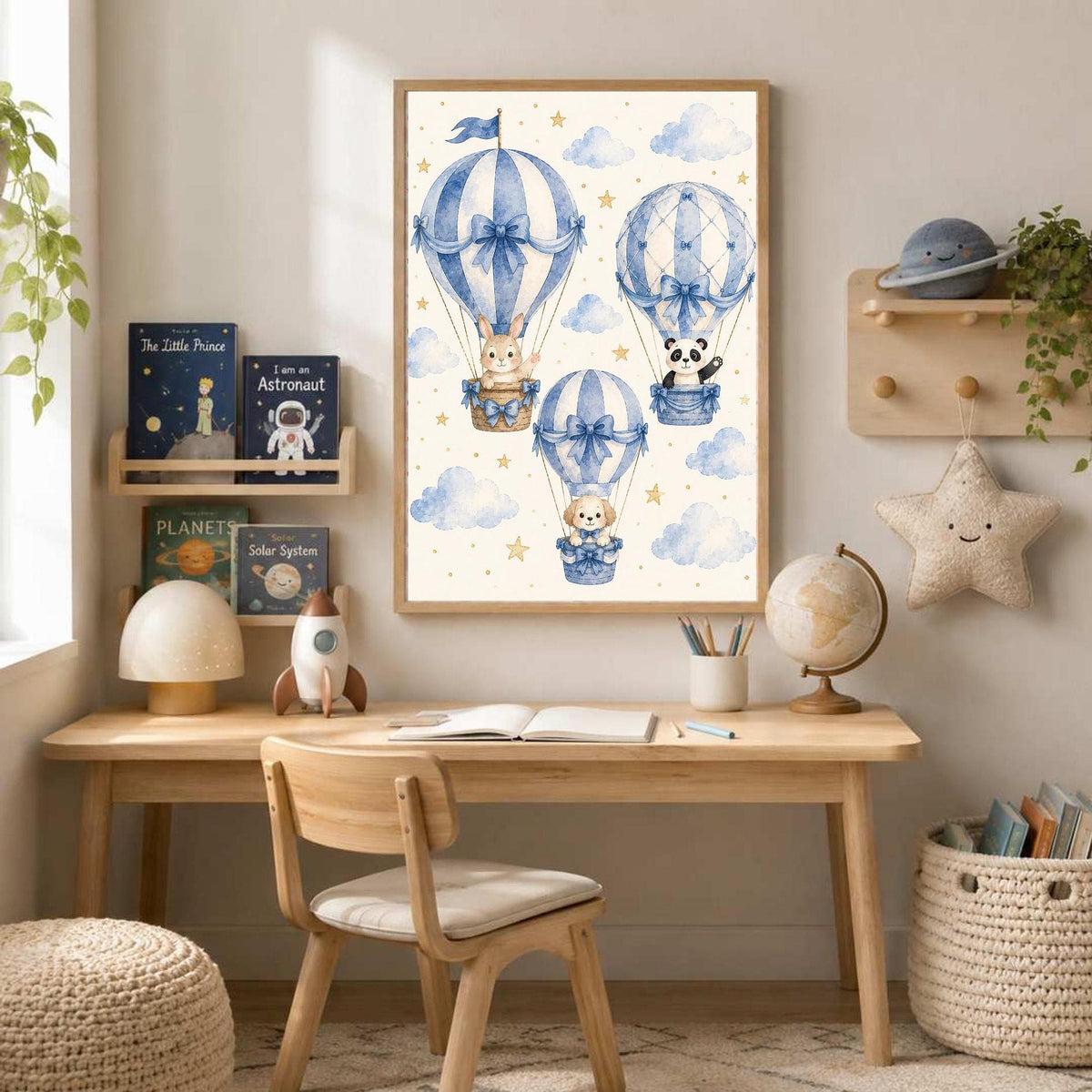 Study desk in a children room featuring a framed watercolor hot air balloon print, a globe, and toy shelves against a neutral wall.