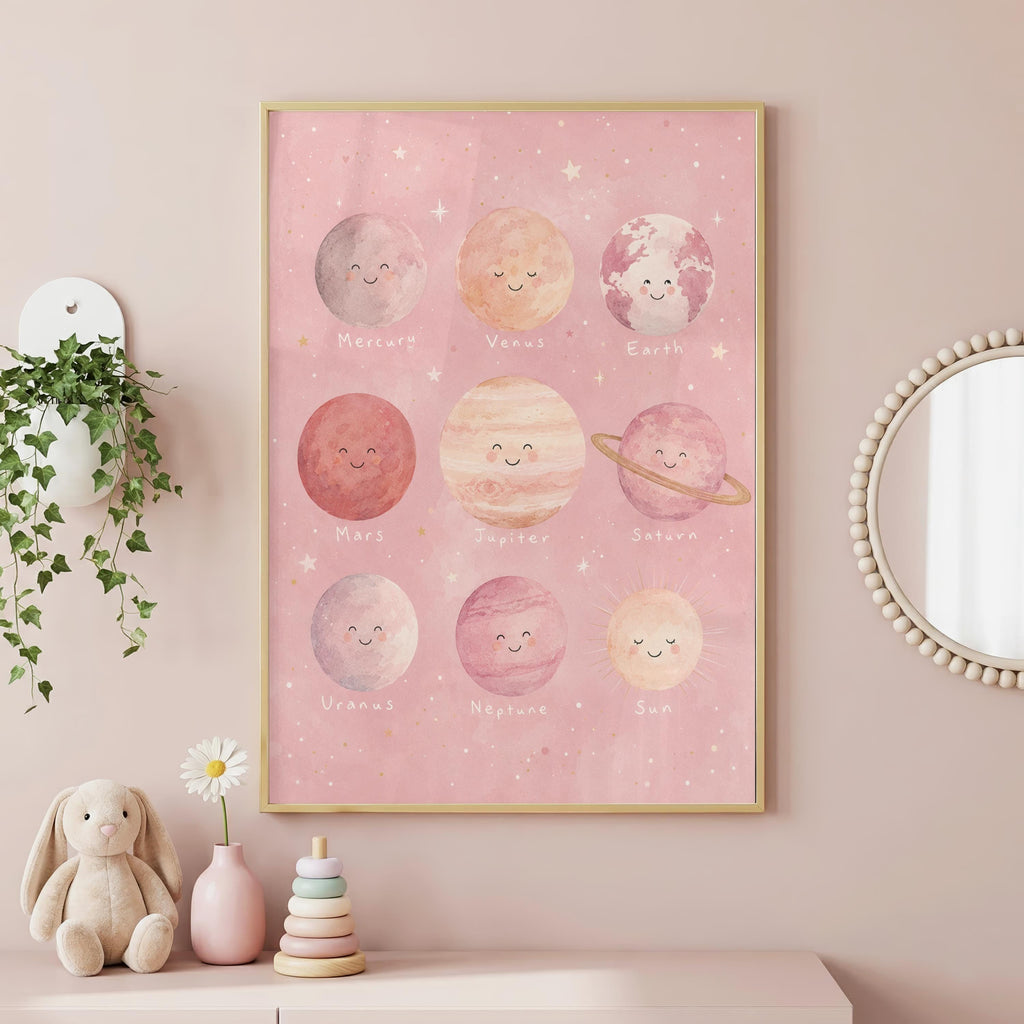 A framed pink solar system art print hangs on a pink wall above a shelf holding toys and a potted plant.