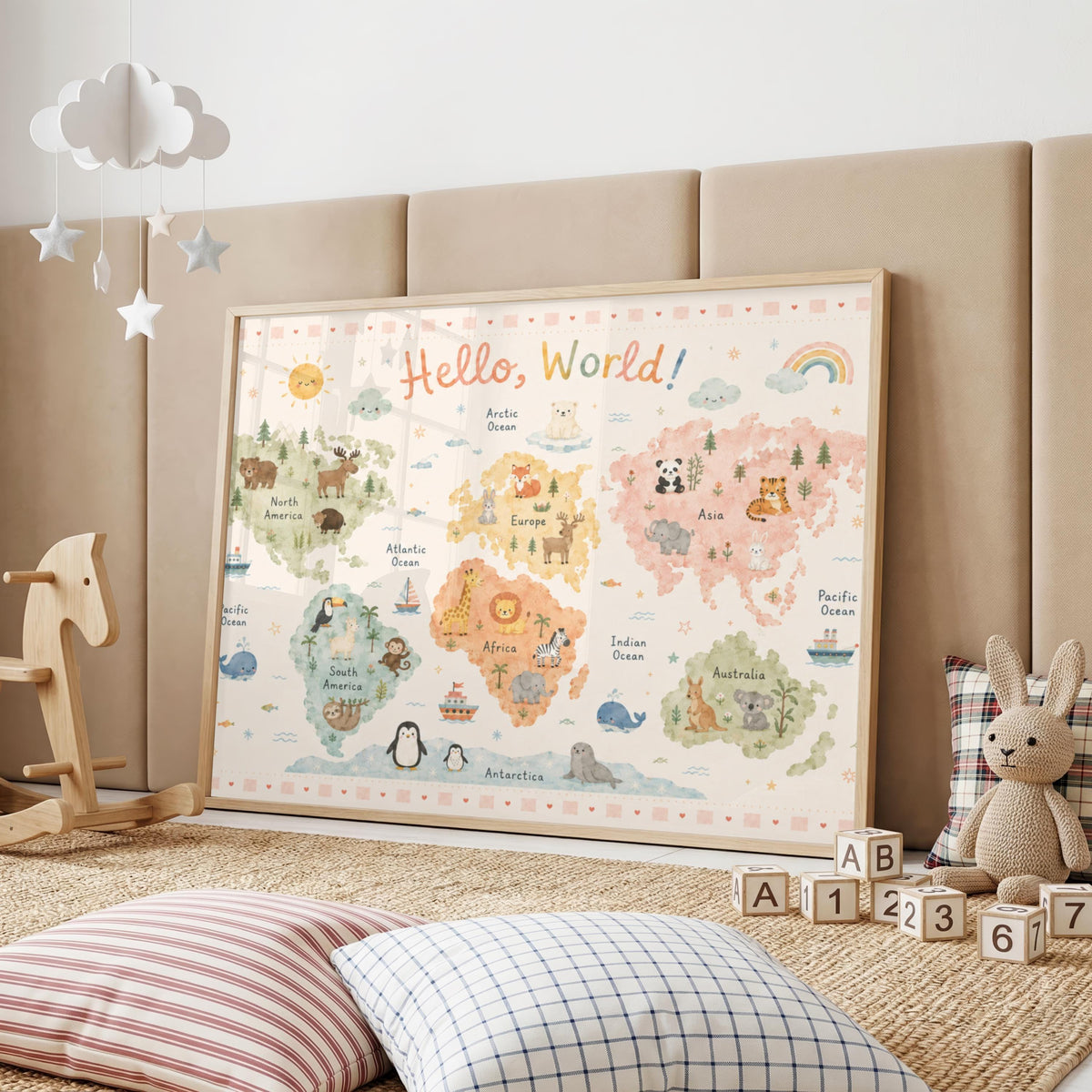 A framed pastel world map poster is displayed in a child's playroom next to a rocking horse and alphabet blocks.