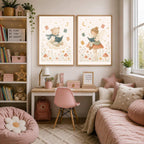 Two framed prints of a bear on a cloud and a fairy on a mushroom hang above a desk in a pink-themed bedroom.