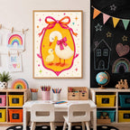 A framed goose print hangs on a white wall next to a blackboard wall with chalk drawings, above toy storage units filled with colorful bins and a globe.