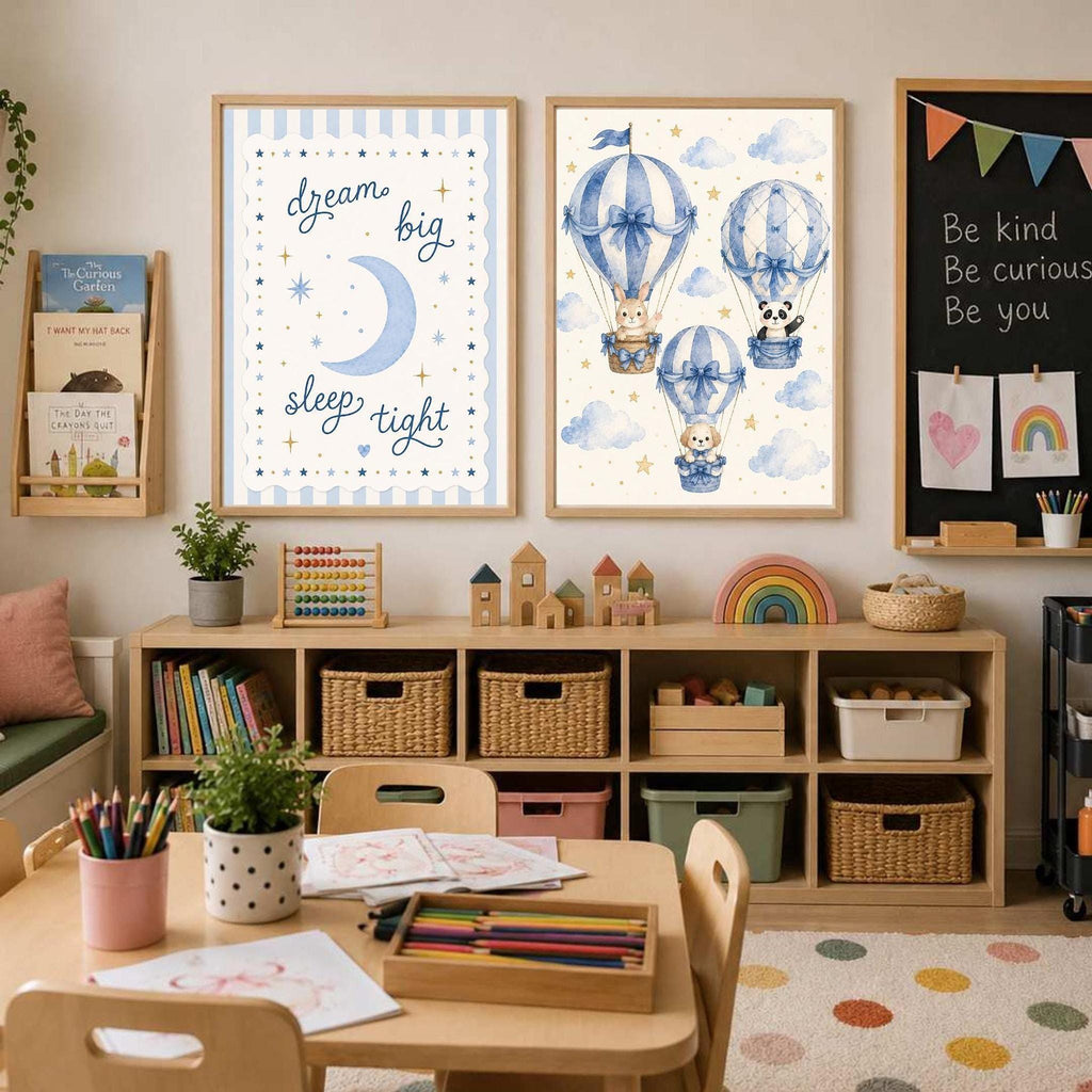 Two framed wall art prints hang above a toy storage unit, one showing blue hot air balloons and the other displaying text that reads sleep tight.