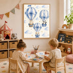Child play area with a large framed watercolor of blue hot air balloons hanging above a low wooden cubby shelf filled with art supplies.
