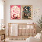 Two framed witch-themed art prints hanging side by side on a wall above a baby crib in a nursery.