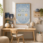 A framed educational geometric shapes poster hangs above a child's wooden desk with books, a globe, and a lamp in a decorated room.