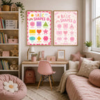 Two framed Basic Shapes posters with different backgrounds hang on a wall above a childs desk and daybed.