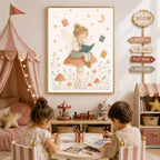 A framed watercolor illustration hangs on a pink wall above two children drawing at a small table, depicting a fairy reading a book while sitting on a large mushroom.