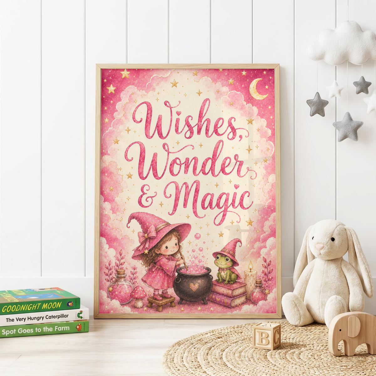 Pink magical nursery wall print featuring the words Wishes, Wonder & Magic with a little witch stirring a cauldron beside a frog, surrounded by potion bottles, books, stars and a crescent moon.