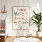 Educational sea animals nursery print titled Sea Friends, featuring labelled illustrations of a whale, dolphin, turtle, octopus, seahorse, starfish, crab, jellyfish, clownfish, shark, seal, penguin and narwhal.