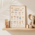 Children's Daily Affirmations wall print featuring positive sayings including I am enough, I am kind and I am proud of who I am, surrounded by pastel rainbows, clouds, birds, balloons, kites, flowers and stars.