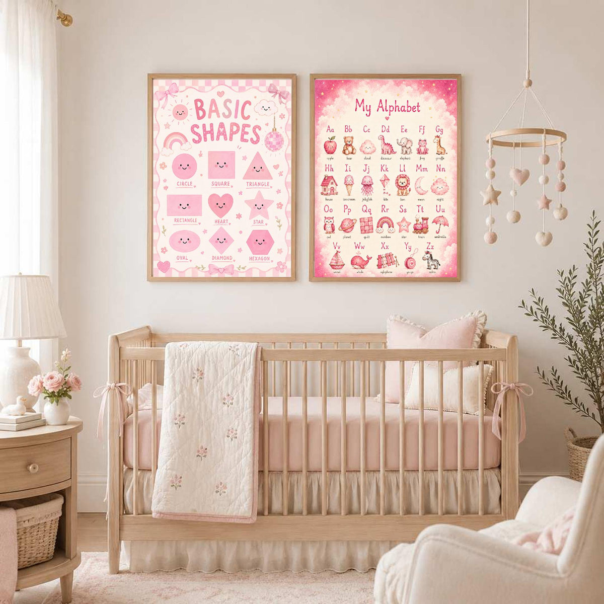 A framed shape poster and a framed alphabet poster are displayed on the wall directly above a wooden baby crib.