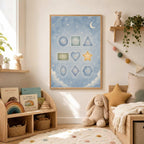 The educational shapes poster hangs in a cozy children room next to a wooden toddler bed and a bookshelf.