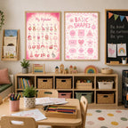 Two educational posters featuring the alphabet and basic shapes hang above a storage shelf and desk in a playroom.