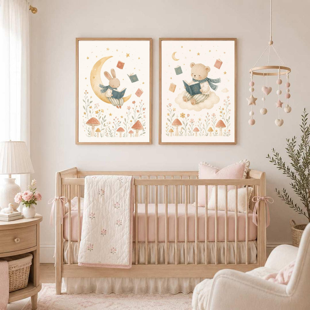 Two framed watercolor prints showing a bunny on the moon and a bear on a cloud hang on a wall above a wooden baby crib.