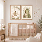Two framed watercolor fairy prints hanging on the wall above a wooden crib in a nursery.