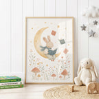 Whimsical nursery wall print featuring a cute rabbit reading a book while sitting on a golden crescent moon, surrounded by floating books, flowers, mushrooms and stars in soft neutral tones.