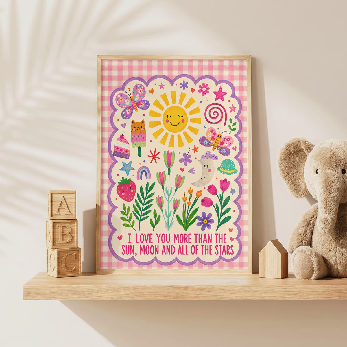 Colourful girls nursery wall print featuring the quote I love you more than the sun, moon and all of the stars, surrounded by smiling sun and moon illustrations, butterflies, flowers, hearts, rainbow and a pink gingham border.