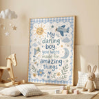 Blue boys nursery wall print featuring the quote My darling boy, you were made for amazing things, surrounded by a smiling sun, aeroplane, clouds, kite, moon, stars, flowers and a blue gingham border.