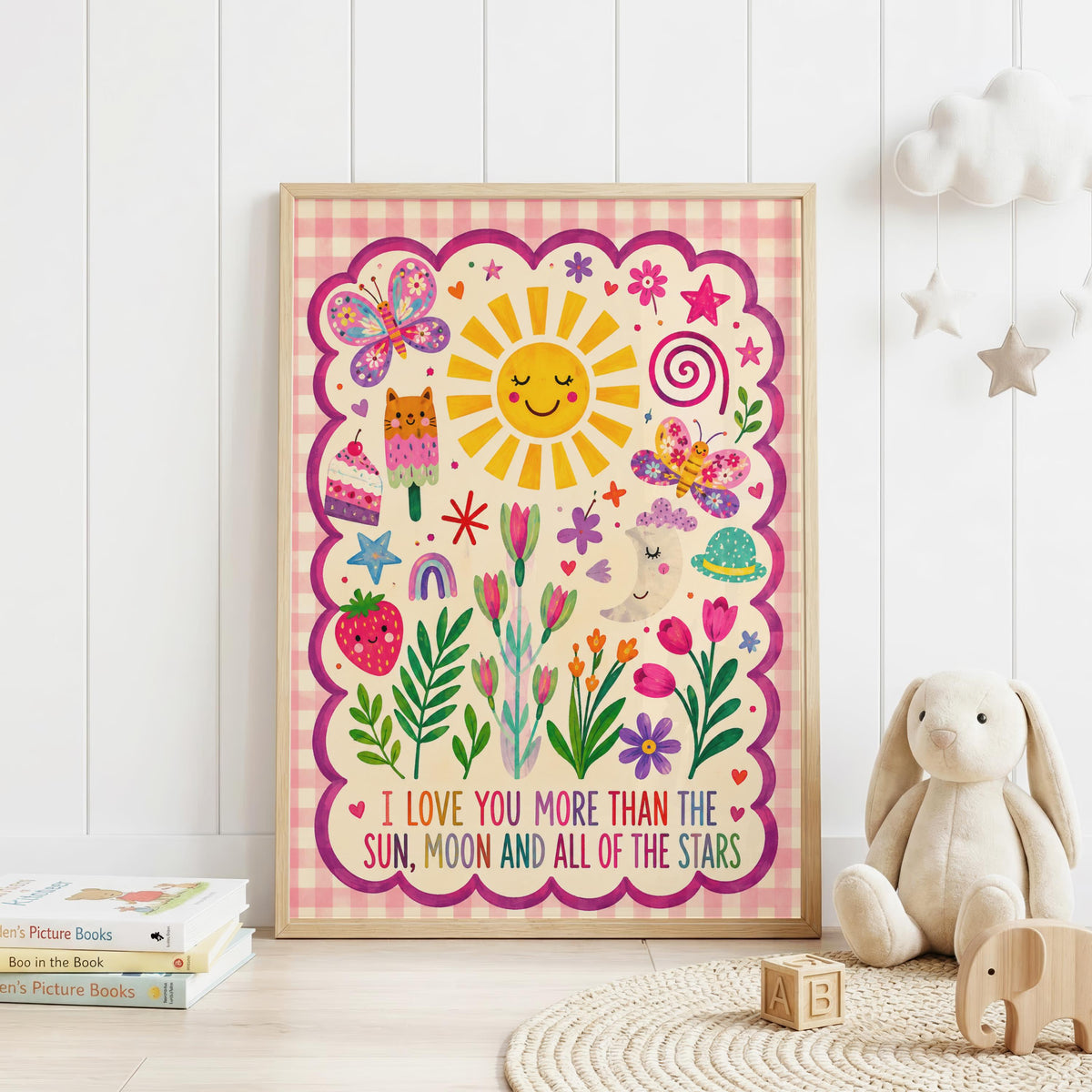 Colourful girls nursery wall print featuring the quote I love you more than the sun, moon and all of the stars, with a smiling sun and moon, butterflies, flowers, hearts, rainbow and pink gingham border.
